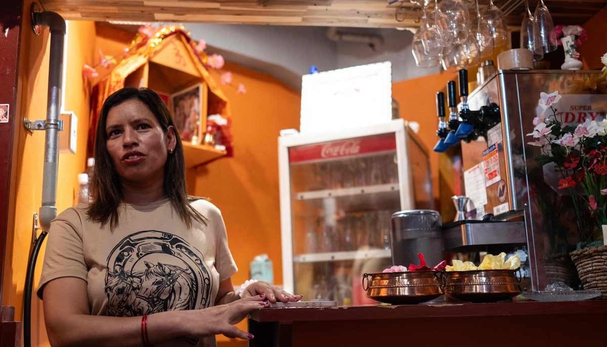 Budhathoki Samjhana, a restaurant owner and business manager visa holder at Chitwan Rhino Restaurant and Bar, looks on inside her bar in the Okubo Shin area, one stop north of Shinjuku, in Tokyo on June 12, 2026. — AFP