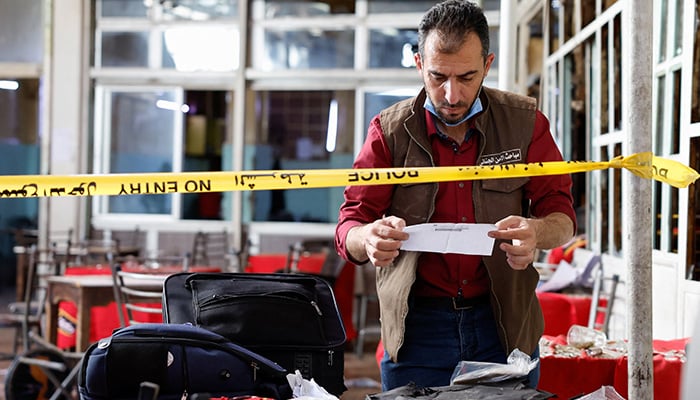 An emergency service member works at the site of what Syrian state media reported was a blast at a cafe in central Damascus, Syria, July 2, 2026. — Reuters