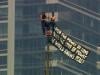 Russian daredevils unfurl banner atop New York's Empire State Building in proposal stunt