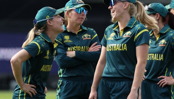 Australias Kim Garth celebrates with teammates after the match. — Reuters/File