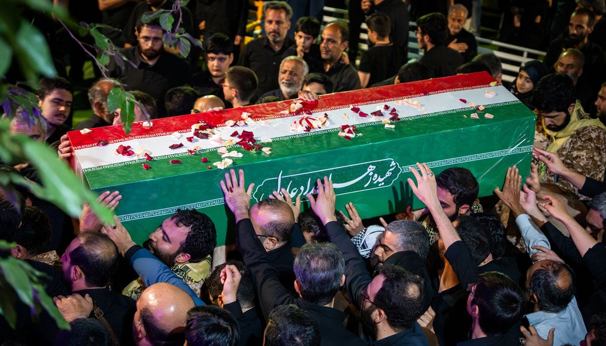 Mourners carry the coffin of Zahra Haddad Adel, wife of Irans Supreme Leader Mojtaba Khamenei, during her funeral in Tehran on July 2, 2026.— AFP
