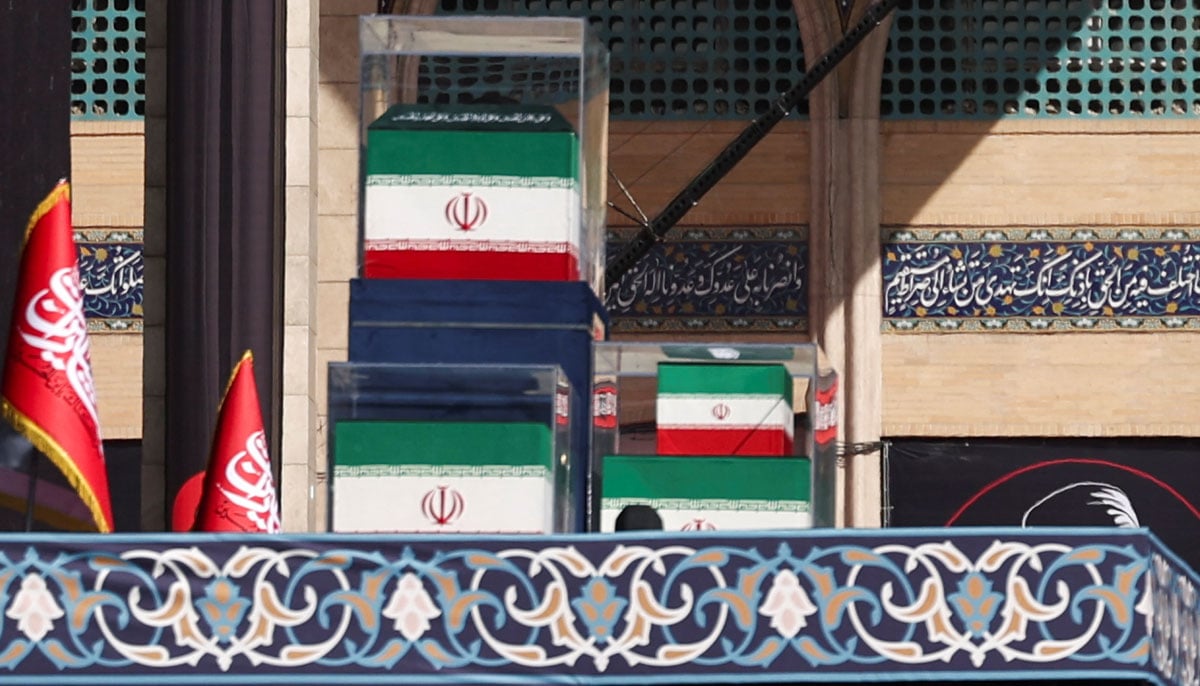 The coffins of Irans late Supreme Leader Ayatollah Ali Khamenei and his family members in the colours of Iranian flags on the stage, as people gather for a public farewell ceremony to pay their respects to late Supreme Leader Ayatollah Ali Khamenei, who was assassinated on February 28 in Israeli and US airstrikes, at the Imam Khomeini Grand Mosalla, in Tehran, Iran July 4, 2026.— Reuters