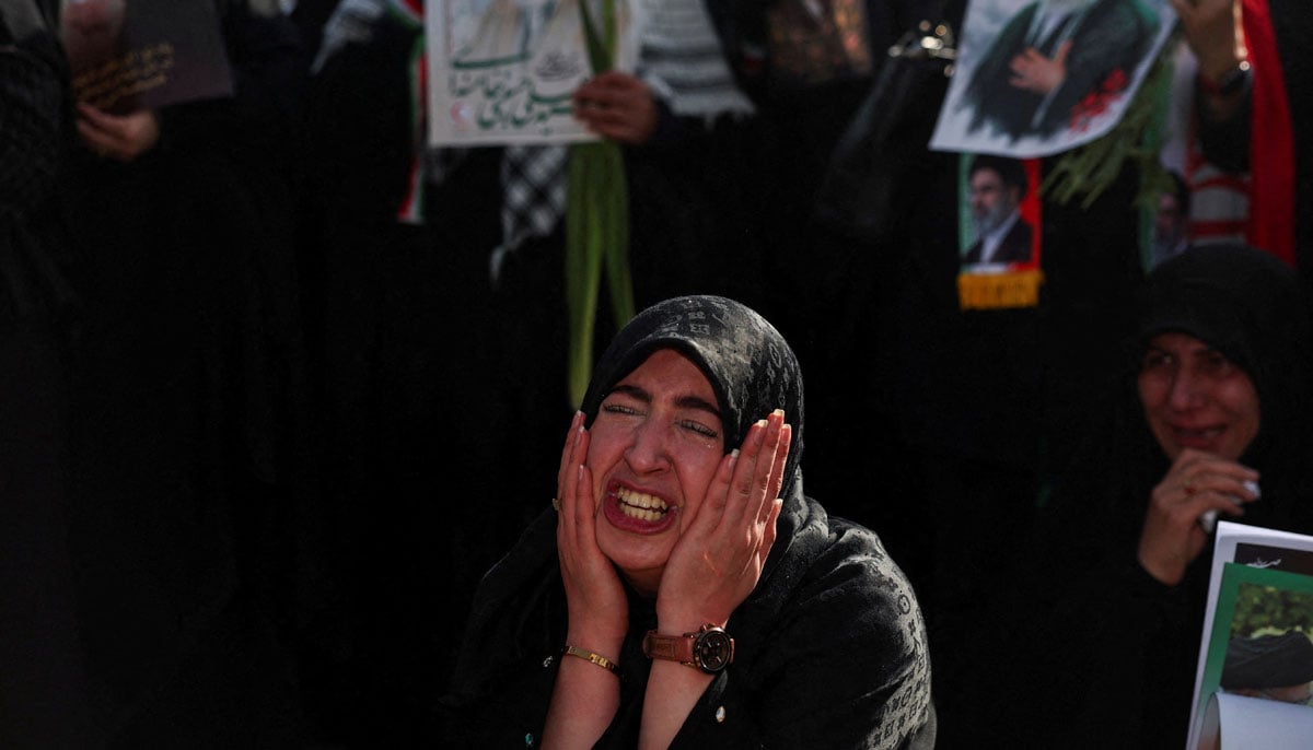 A woman reacts as mourners gather on the day of a public farewell ceremony to pay their respects to late Supreme Leader Ayatollah Ali Khamenei, who was assassinated on February 28 in Israeli and US airstrikes, at the Imam Khomeini Grand Mosalla, in Tehran, Iran July 4, 2026.— Reuters
