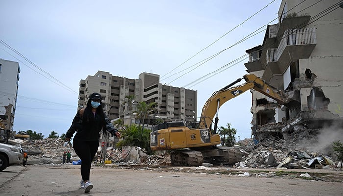 A backhoe demolishes a building in La Guaira, Venezuela on July 4, 2026, following the June 24 twin earthquakes. — AFP