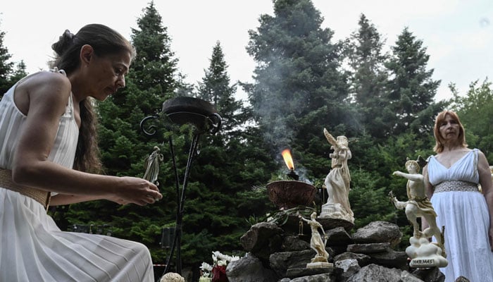 Reenactors dressed as ancient Greeks perform a ritual at the foothills of Mount Olympus as part of the four-day Promitheia Festival honouring ancient Greek Gods, near Litochoro, northern Greece, on July 3, 2026. — AFP