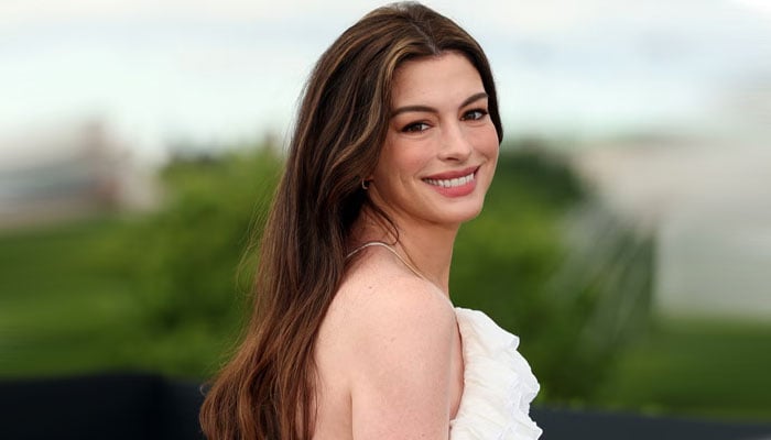 Anne Hathaway lights up The Odyssey photocall with pregnancy glow