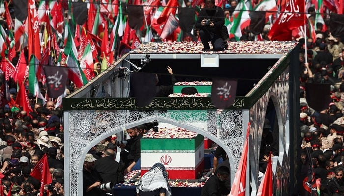 A vehicle carrying coffins of Irans late Supreme Leader Ayatollah Ali Khamenei and his family members, makes its way as people attend a funeral procession for Khamenei, who was assassinated on February 28 in Israeli and US airstrikes, in Tehran, Iran, July 6, 2026. — Reuters