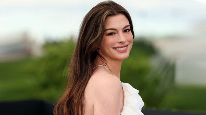 Anne Hathaway lights up 'The Odyssey' photocall with pregnancy glow