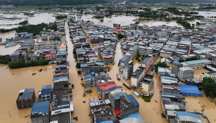 An aerial view shows flooding in Pingshan village at Xiaoyi town in Hengzhou, Chinas southern Guangxi region on July 6, 2026. — AFP