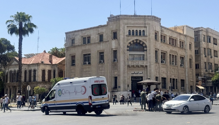 An ambulance drives past the site where explosive devices blew up near a hotel where French President Emmanuel Macron was meant to be staying, in Damascus, Syria, July 7, 2026. — Reuters