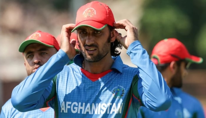 Shapoor Zadran walks back after his teams loss, Zimbabwe v Afghanistan, 1st ODI, Bulawayo, October 16, 2015. — AFP