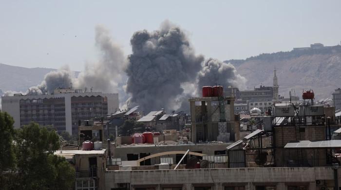 Blasts hit area near Damascus hotel during Macron visit