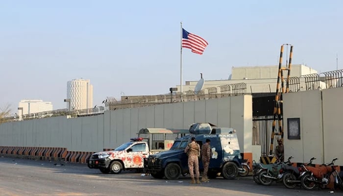 Police and paramilitary vehicles stand outside the US Consulate General, a day after a protest following news of US and Israeli strikes on Iran that martyred Supreme Leader Ayatollah Ali Khamenei, in Karachi, March 2, 2026. — Reuters