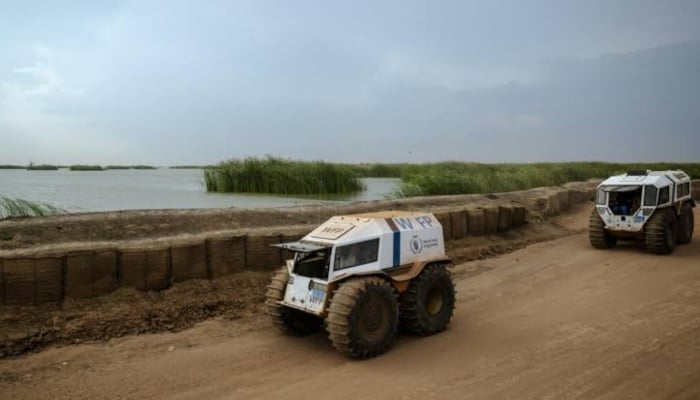 The World Food Programme (WFP) Sherps drive alongside the Bentiu dykes in Bentiu, Unity State, South Sudan, on November 3, 2025. — AFP