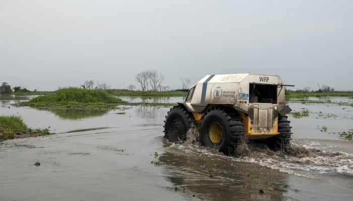 An all-terrain Sherp vehicle, operated by World Food Programme (WFP), is driven through floodwaters, to deliver aid to vulnerable communities, in Twic East, Jonglei State, South Sudan, March 9, 2023. — Reuters