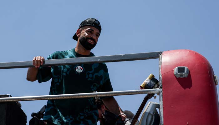 Egypts Mohamed Salah looks at the crowd from a bus as Egypts national team is welcomed by fans at El Alamein International Airport upon its return from the 2026 FIFA World Cup, ahead of an official reception by President Abdel Fattah al-Sisi, in El Dabaa, Egypt, July 10, 2026. — Reuters
