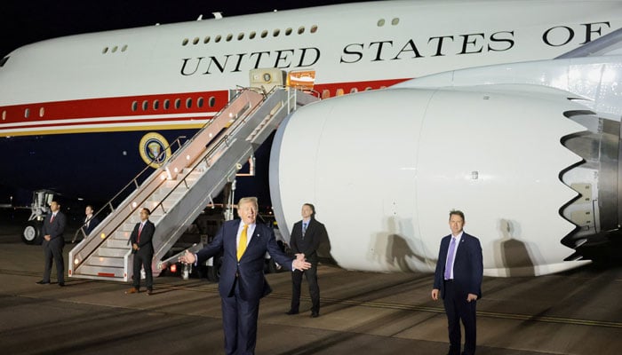 US President Donald Trump gestures during a stop to switch to the Qatari-gifted Air Force One after arriving on one of the older planes operating as Air Force One, to return to Washington after his participation in a NATO leaders summit in Turkey, at RAF Mildenhall, in Suffolk, Britain, July 8, 2026. — Reuters