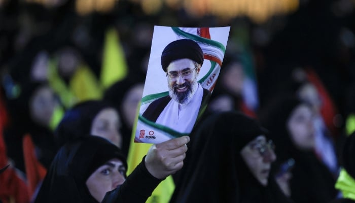 A person holds a portrait of Irans Supreme Leader Mojtaba Khamenei, as people gather to mourn Irans late Supreme Leader Ayatollah Ali Khamenei, who was assassinated on February 28 in Israeli and US airstrikes, in the southern suburbs of Beirut, Lebanon, July 8, 2026. — Reuters