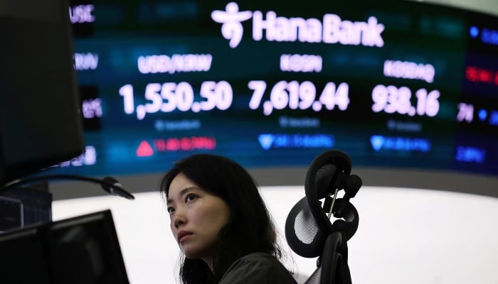 A currency dealer works in front of an electronic board displaying the exchange rate between the US dollar and South Korean won, the Korea Composite Stock Price Index (KOSPI) and South Korean won and the Korea Securities Dealers Automated Quotations (KOSDAQ) at the dealing room of a bank in Seoul, South Korea, June 8, 2026. — Reuters