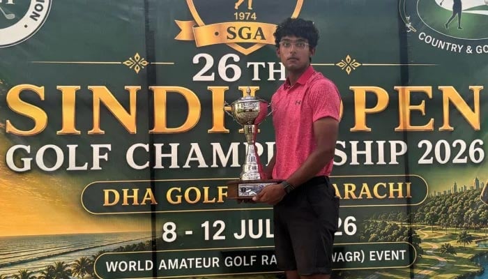 Amateur golfer Omar Khalid Hussain poses with the trophy after winning the 2026 Sindh Open Golf Championship at the Defence Authority Country and Golf Club (DACGC) in Karachi on July 12, 2026. — Reporter
