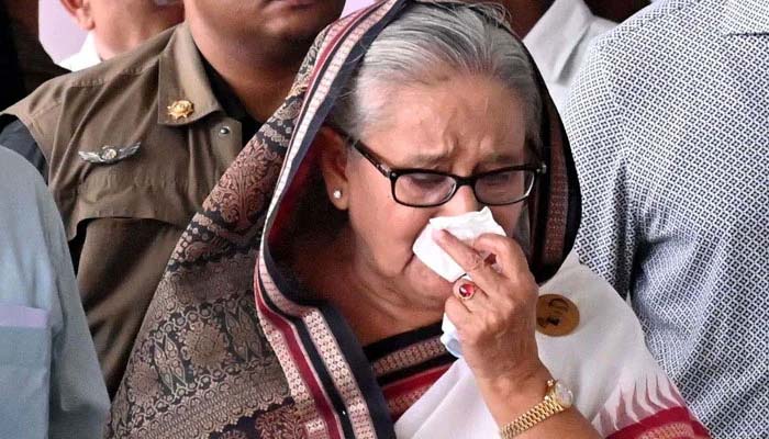 Prime Minister Sheikh Hasina weeps while she visits a metro station in Mirpur vandalised by students during the anti-quota protests. — AFP