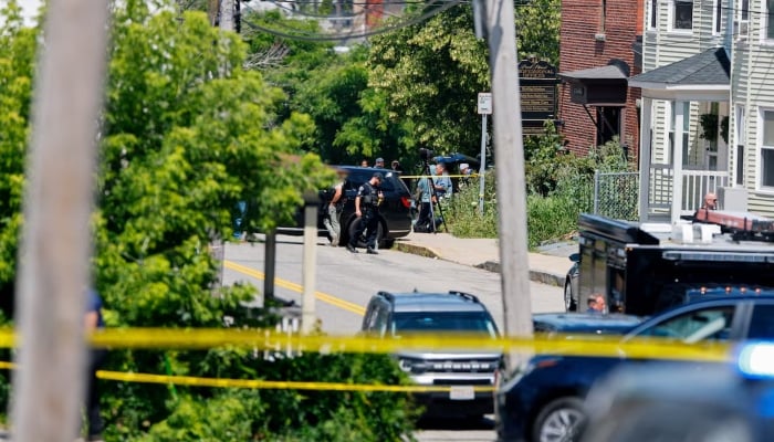Police work at the scene of a shooting involving US Immigration and Customs Enforcement (ICE) in Biddeford, Maine, US, July 13, 2026. — Reuters
