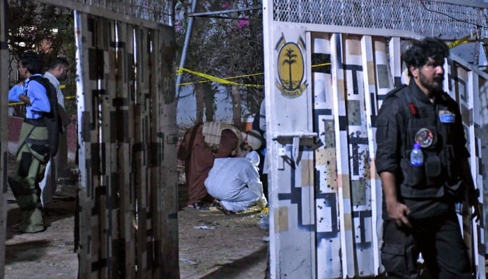 Officials of investigation agencies gather evidences after attack on Rangers compound in Karachi on June 27, 2026. — Online