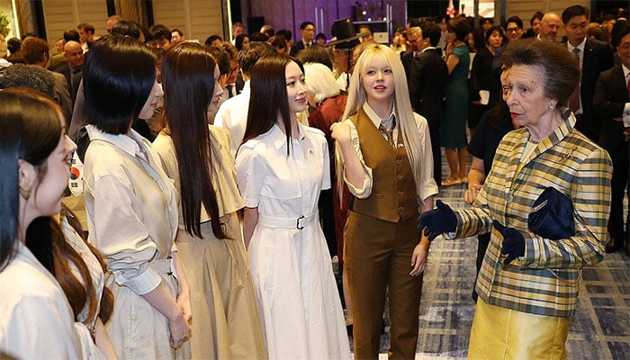 Princess Royal meets South Koreas K-Pop sensations NMIXX in checked jacket