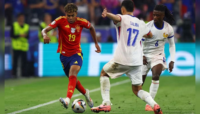This representational image shows Spains Lamine Yamal in action against Frances William Saliba and Eduardo Camavinga during the Euro 2024 semi-final at the Munich Football Arena in Munich, Germany, on July 9, 2024. — Reuters