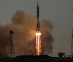 Russia sends American and two cosmonauts to space station 