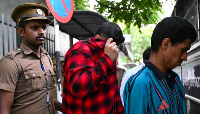 Jaffna Kings team co-owner of the Lanka Premier League (LPL) franchise Manjot Kalra (centre) is taken to prison after being arrested in Colombo on July 17, 2026. — AFP