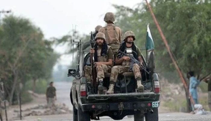 Pakistan Army personnel travelling on a military vehicle. — AFP/ File