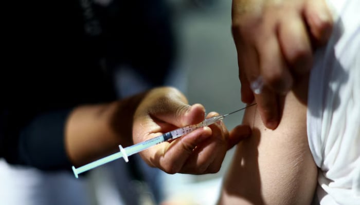 A nurse administers a dose of the measles vaccine to a man during a vaccination campaign in response to a measles outbreak, at the Estadio Olimpico Universitario in Mexico City, Mexico, November 12, 2025. — Reuters