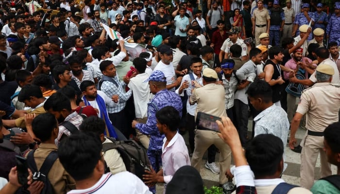 Police restrain people gathered near Jantar Mantar, in New Delhi, India, July 20, 2026. — Reuters