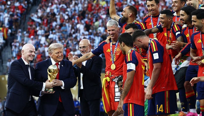 US President Donald Trump and Fifa President Gianni Infantino with the World Cup trophy during the trophy presentation. — Reuters