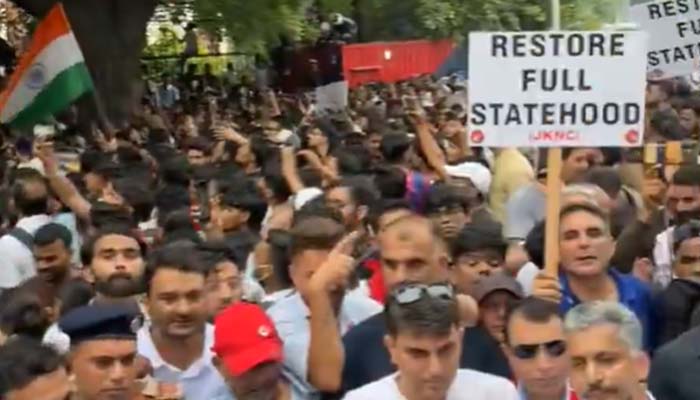 Protesters hold placards during a protest against the Modi government in New Delhi on July 20, 2026. — X/@OmarAbdullah