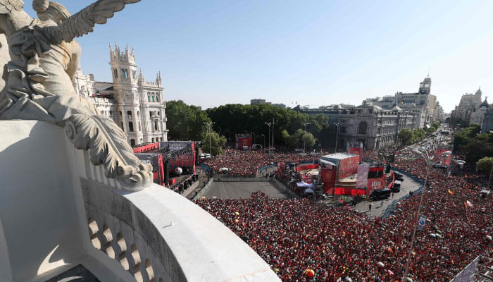 Spain fans pack Cibeles Square in Madrid on July 20, 2026, as they await the arrival of Spain´s players one day after the national football team won their second World Cup title following a 1-0 victory against Argentina. — AFP