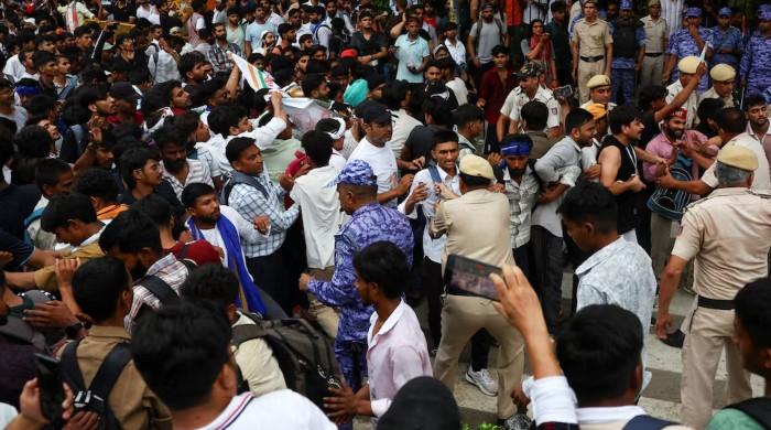 Police cane supporters of India's cockroach movement as thousands gather for march