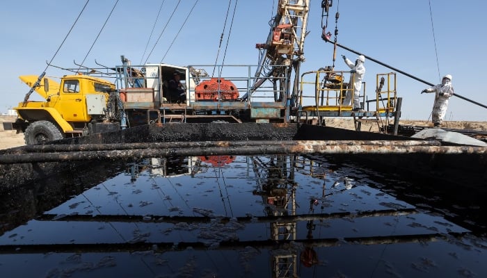 Specialists work at a drilling rig at the Airankol oil field operated by Caspiy Neft in the Atyrau region, Kazakhstan, April 20, 2026. — Reuters