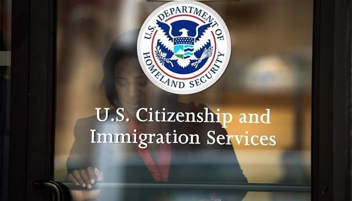 A woman leaves the US Citizenship and Immigration Services offices in New York, August 15, 2012. — Reuters