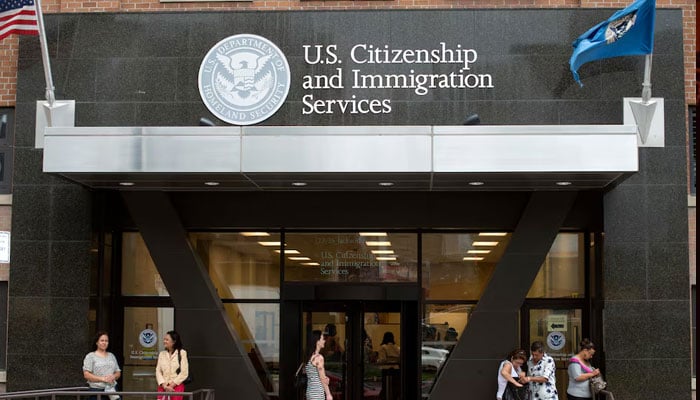 People stand on the steps of the US Citizenship and Immigration Services offices in New York, August 15, 2012. The US government began accepting applications on Wednesday from young illegal immigrants seeking temporary legal status under relaxed deportation rules announced by the Obama administration in June.— Reuters