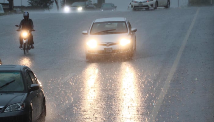Vehicles of the way during rain in Islamabad, July 1, 2026. — INP