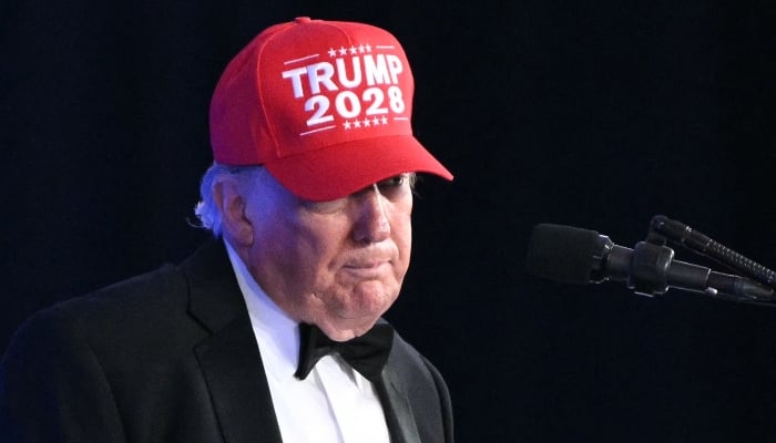 US President Donald Trump wears a Trump 2028 hat while he speaks during the 2026 White House Correspondents´ Association (WHCA) Dinner at the Waldorf Astoria in Washington, DC, on July 24, 2026. — AFP