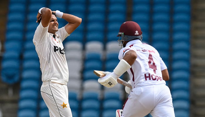 Mohammad Abbas (L) of Pakistan reacts as Shai Hope (R) of West Indies runs during the first day of the first Test cricket match between West Indies and Pakistan at the Brian Lara Cricket Academy in Tarouba, Trinidad and Tobago, on July 25, 2026. — AFP