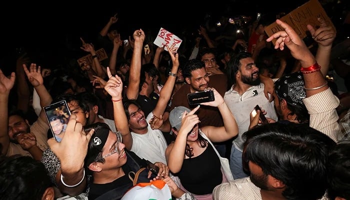 Cockroach Janta Party (CJP) supporters celebrate after the resignation of Education Minister Dharmendra Pradhan over National Eligibility cum Entrance Test (NEET) examination paper leaks, at Jantar Mantar in New Delhi, India, July 25, 2026. — Reuters