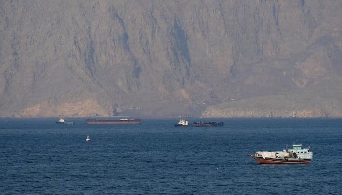 Ships and tankers in the Strait of Hormuz off the coast of Musandam, Oman, April 18, 2026. — Reuters