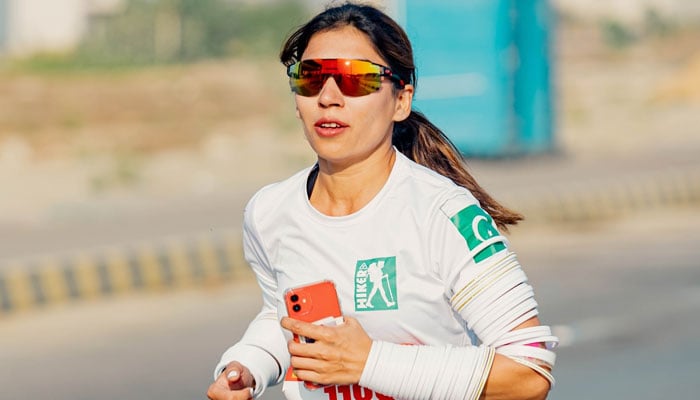 Mountaineer and climber Anum Uzair runs during Karachi marathon. — Instagram/@anumuzair