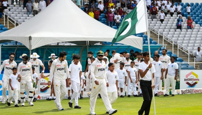 Pakistan skipper Babar Azam (second right) lead his team on to the field during the first day of first Test match against West Indies at Brian Lara Cricket Academy in Tarouba, Trinidad and Tobago on July 25, 2026. — AFP