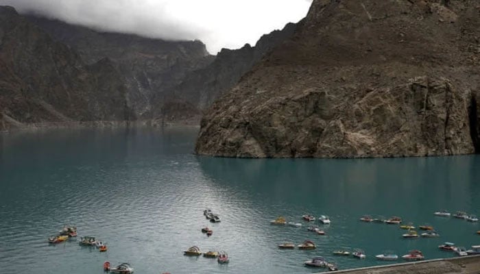 Boats gather on Attabad lake, which was formed due to a landslide in Attabad, in the Karakoram mountain range in Gilgit-Baltistan. — AFP/File