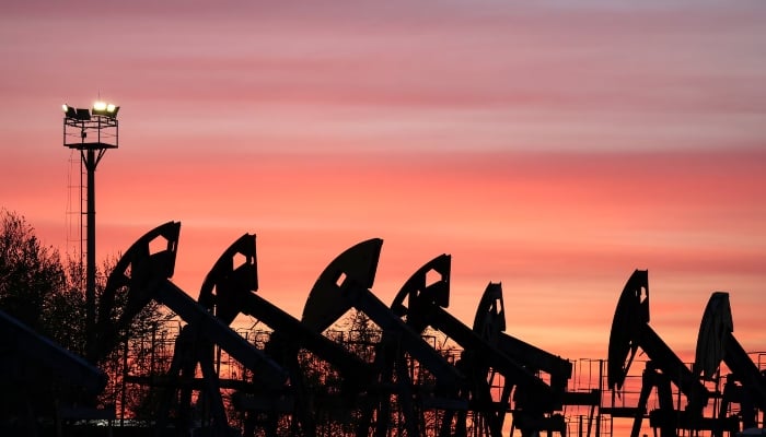 Sunset clouds glow over pump jacks at the Airankol oil field operated by Caspiy Neft in the Atyrau region, Kazakhstan, April 21, 2026. — Reuters